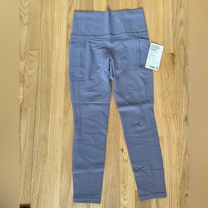 NWT Athleta purple Salutation Leggings